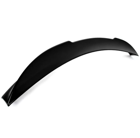 A black, curved car spoiler rests on a plain white background, displaying its smooth, aerodynamic design intended for vehicle performance enhancement. No text present.