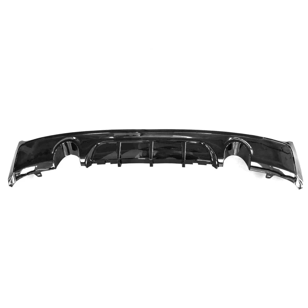 A black, curved car bumper with cutouts, lying flat on a white background.