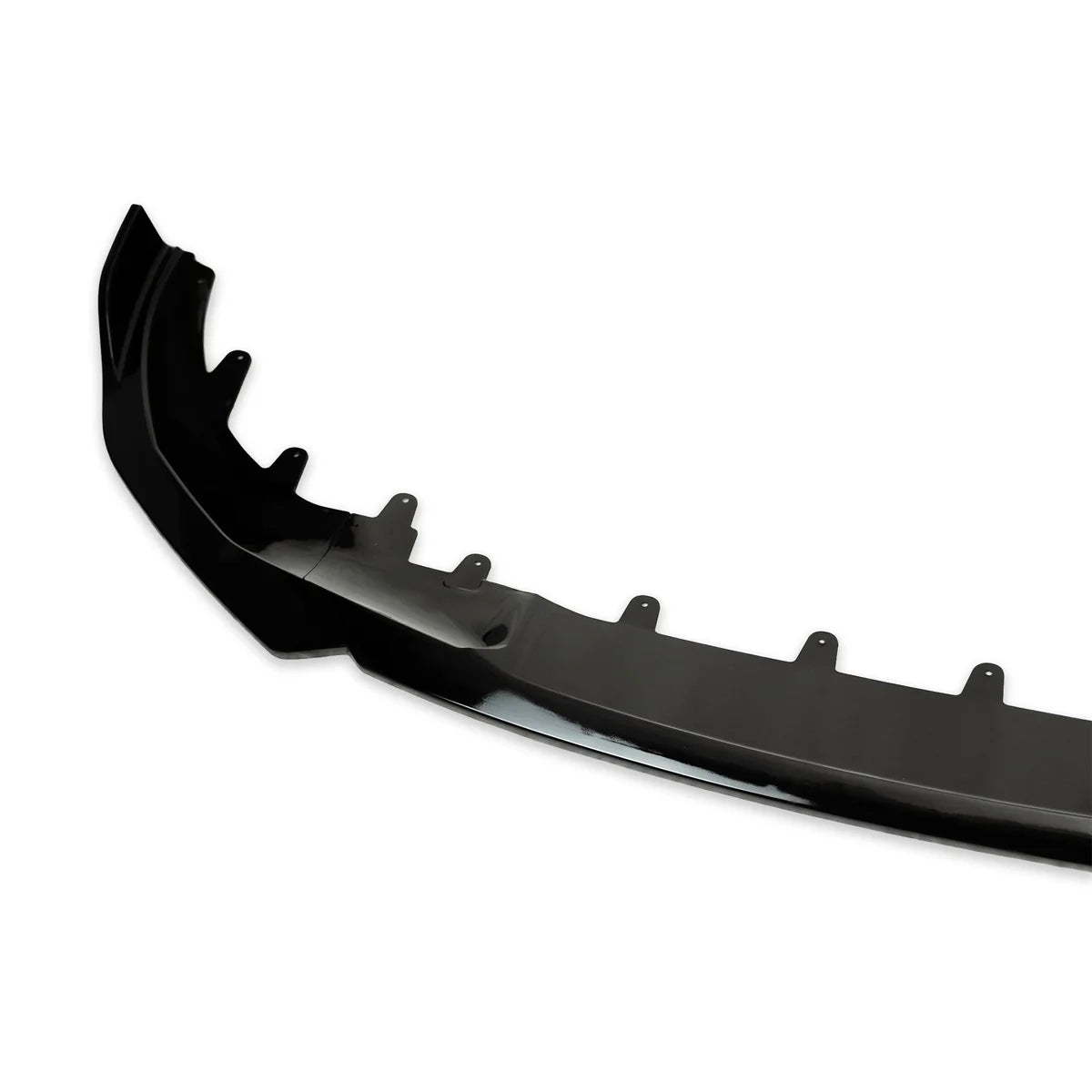 A black car bumper cover with mounting tabs is positioned against a plain white background, showcasing its contour and attachment points.