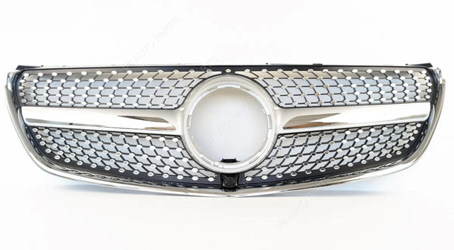 A shiny car grille features a prominent circular center, intricate mesh pattern, and chrome accents, positioned against a plain white background.
