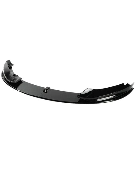 A glossy black car spoiler rests against a plain white background, featuring aerodynamic curves and multiple attachment points for installation.