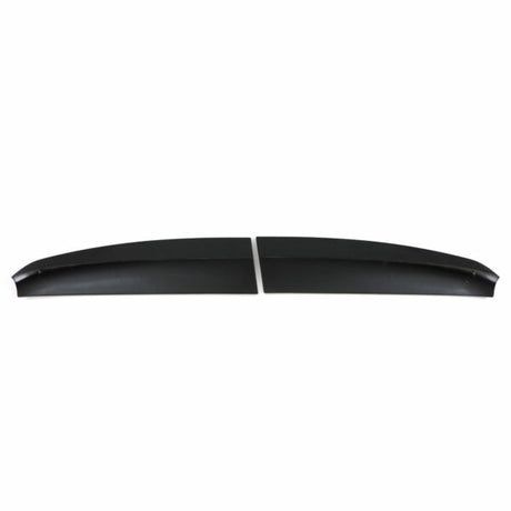 Two black, elongated spoiler pieces lie side by side, separated by a small gap, against a plain white background.