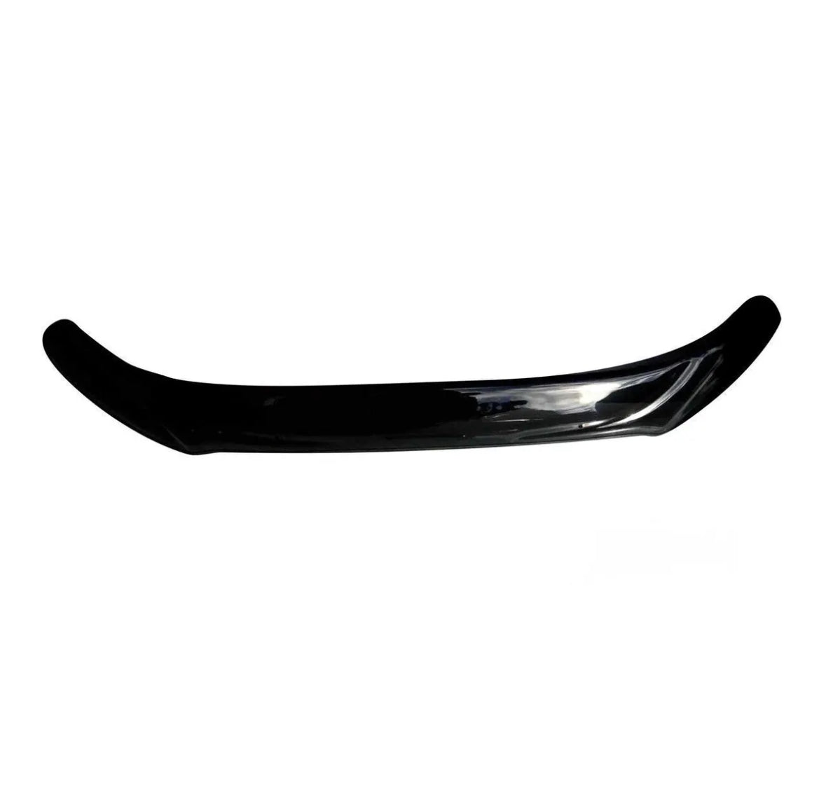 A glossy black car spoiler curving slightly upward lies against a plain white background, highlighting its sleek design and smooth surface.