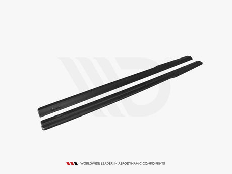 Two black aerodynamic vehicle components lie parallel on a white surface. Text below reads, "WORLDWIDE LEADER IN AERODYNAMIC COMPONENTS."