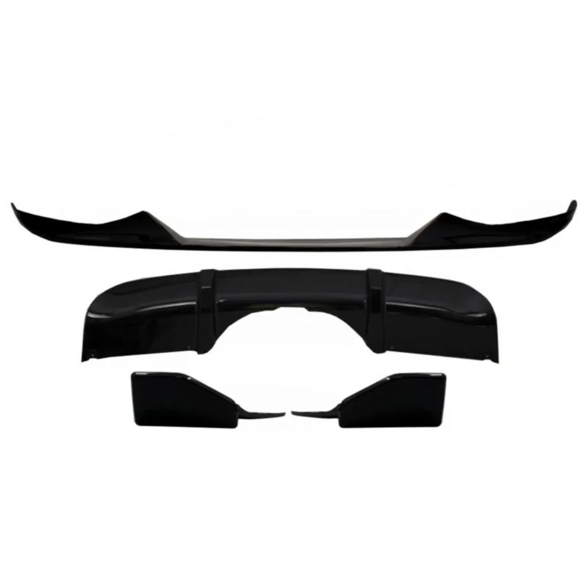 Black car body kit components arranged on a plain white background, including a front lip spoiler, a rear diffuser, and side skirts, designed for aerodynamic enhancement.