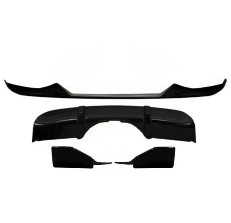 Black car body kit components arranged on a plain white background, including a front lip spoiler, a rear diffuser, and side skirts, designed for aerodynamic enhancement.
