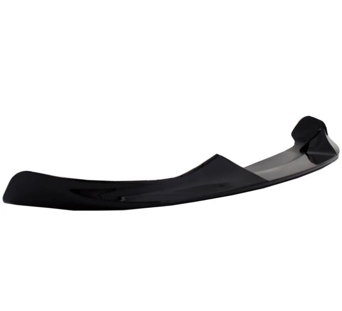 Curved black car spoiler, resting on its edge, in a plain white background, suggesting an automotive accessory focus.