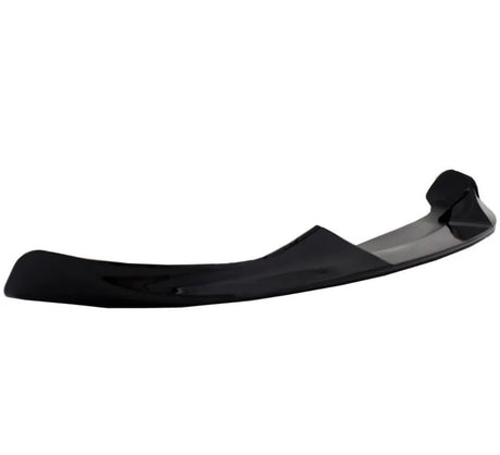 Curved black car spoiler, resting on its edge, in a plain white background, suggesting an automotive accessory focus.
