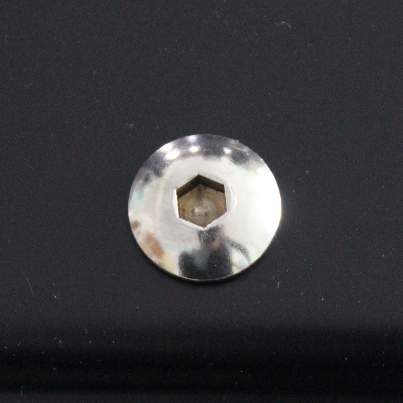 A metallic hex socket screw head embedded in a smooth, dark surface, reflecting light. The background is glossy, enhancing the screw's shiny appearance.