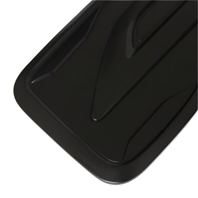 A black plastic tray features sleek, angular grooves and a shiny surface, positioned against a plain white background.