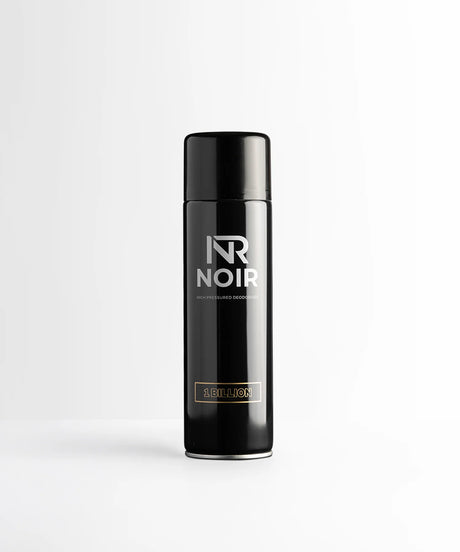 Black cylindrical deodorant can labeled "NR NOIR HIGH PRESSURED DEODORISER 1 BILLION" stands upright against a plain, light gray background.