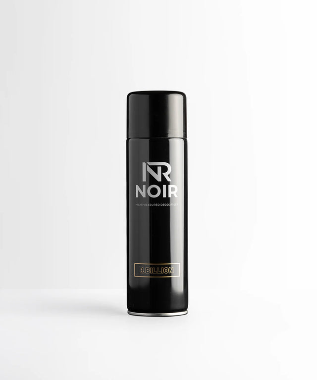 Black cylindrical deodorant can labeled "NR NOIR HIGH PRESSURED DEODORISER 1 BILLION" stands upright against a plain, light gray background.