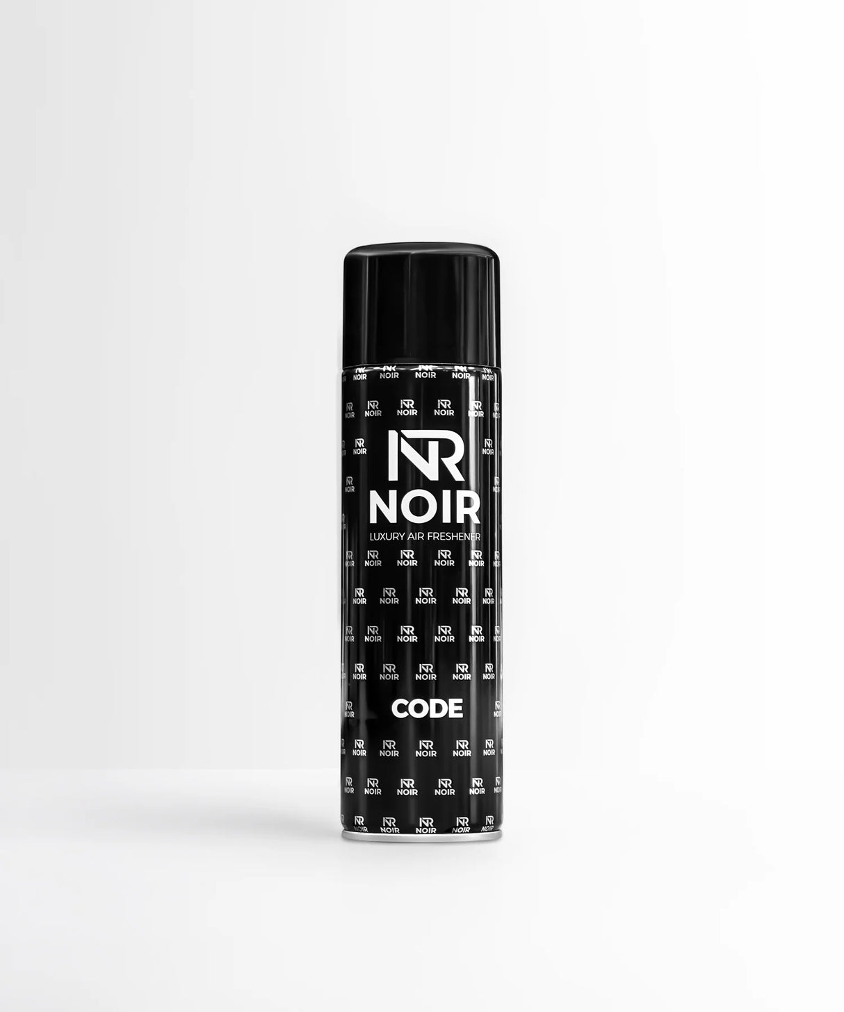A black aerosol can stands on a smooth surface with a minimalist background. The can displays the text: "NR NOIR LUXURY AIR FRESHENER CODE" and is patterned with smaller "NR NOIR" logos.