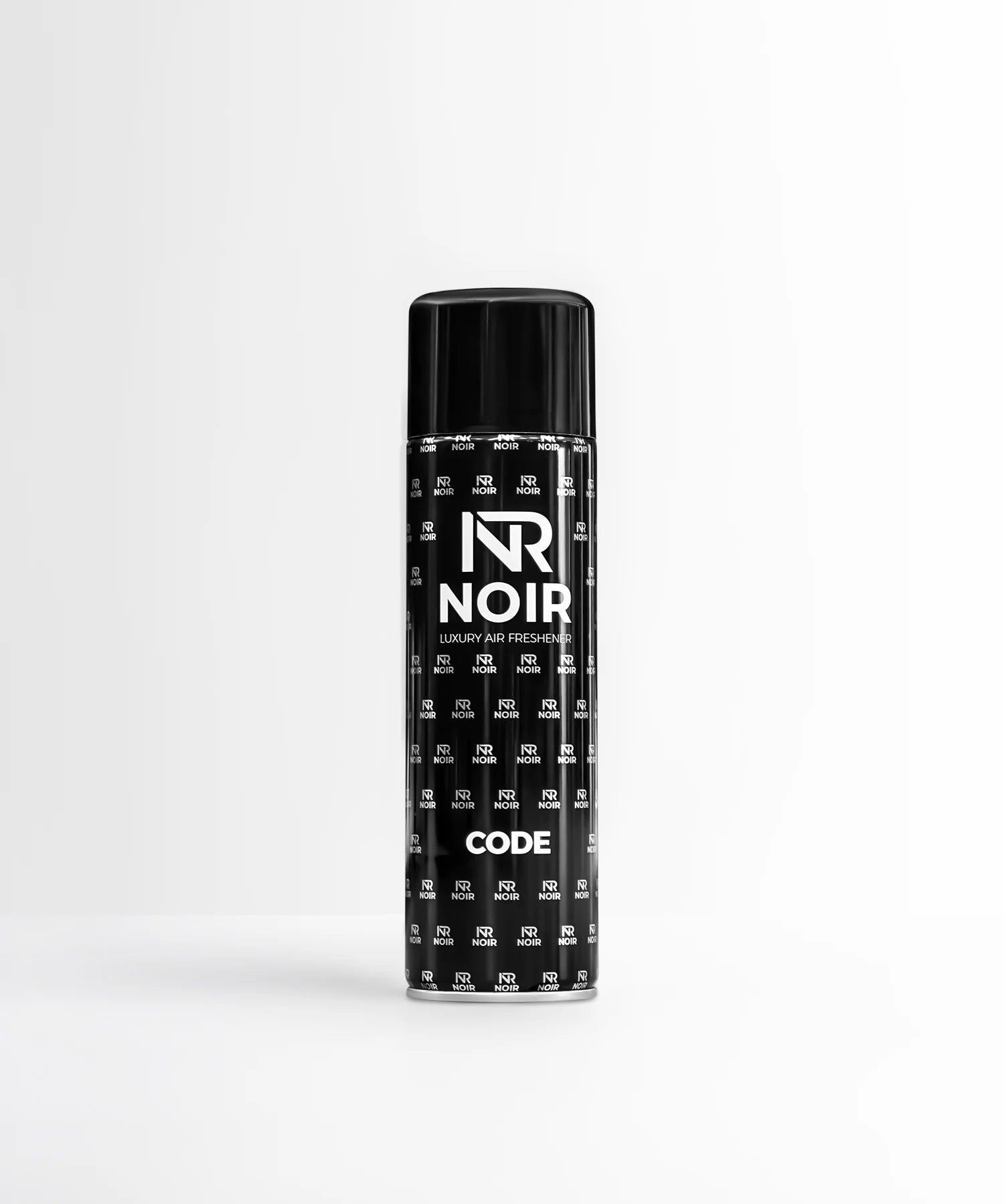 A black aerosol can stands on a smooth surface with a minimalist background. The can displays the text: "NR NOIR LUXURY AIR FRESHENER CODE" and is patterned with smaller "NR NOIR" logos.