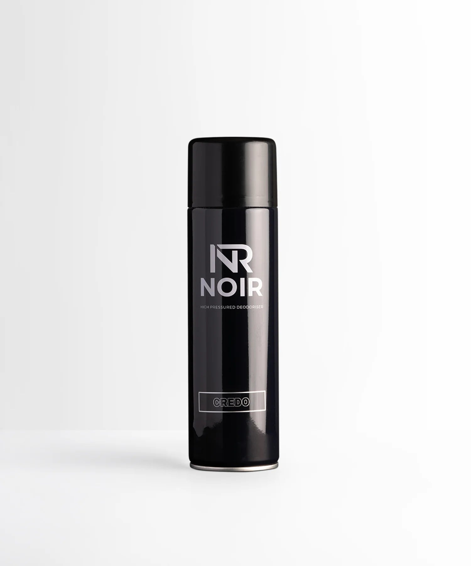 A black aerosol can labeled "NR NOIR" and "CREDO" stands upright, centered on a white background. Text reads: "HIGH PRESSURED DEODORISER."