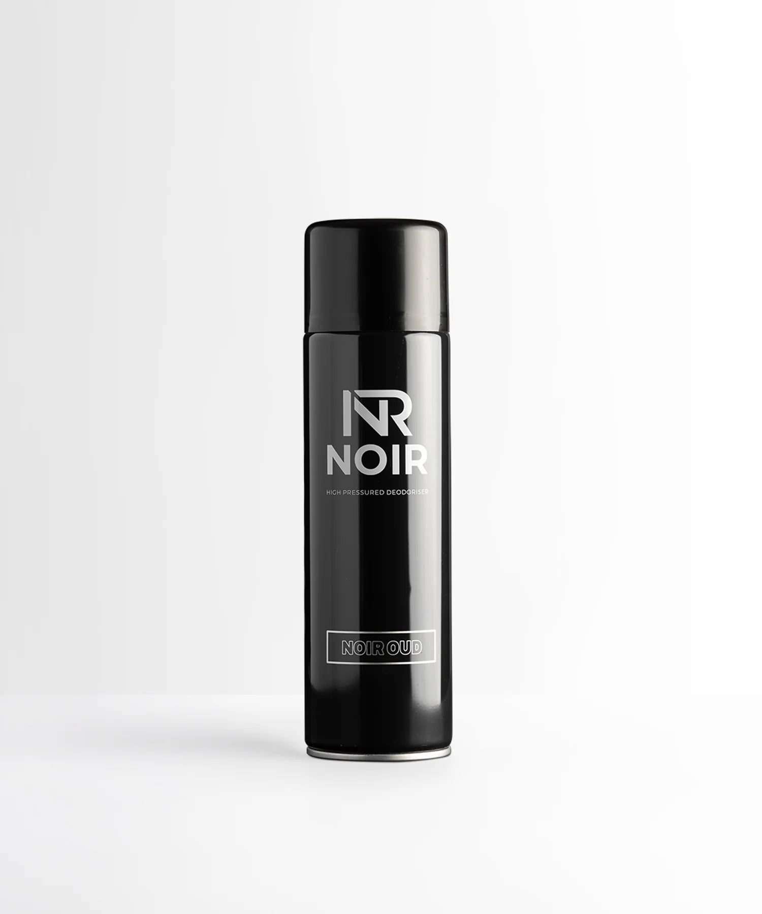 A black aerosol can stands upright, labeled "NR NOIR," "HIGH PRESSURED DEODORISER," and "NOIR OUD," set against a simple white background.
