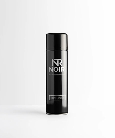 A black aerosol can stands upright, labeled "NR NOIR," "HIGH PRESSURED DEODORISER," and "NOIR OUD," set against a simple white background.