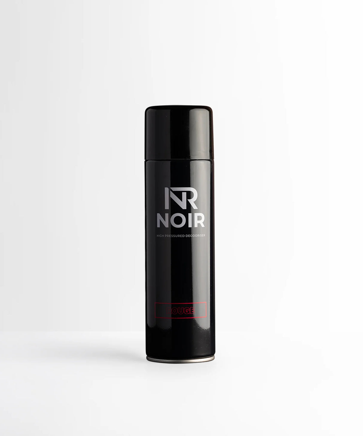 A black aerosol can labeled “NR NOIR” and “HIGH PRESSURED DEODORISER” stands upright on a plain white surface. The word “ROUGE” is in red near the base.