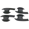 Four black, curved, plastic car door handle covers are positioned symmetrically on a plain background. They have an ergonomic design with cutouts for easy installation.