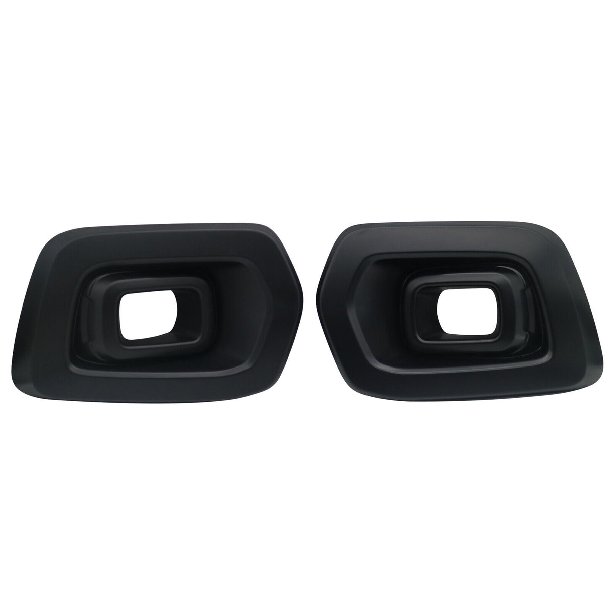 Two black exhaust tips with rectangular openings are facing forward. They are placed side by side against a plain white background.