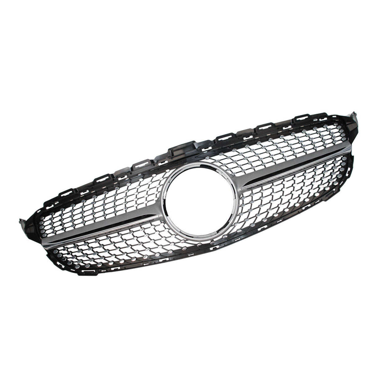 A hexagonal car grille with silver trim and a central circular emblem space is placed against a plain white background, highlighting its sleek design and mesh pattern.