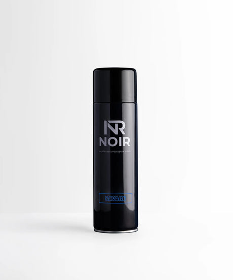 A sleek, dark cylindrical canister labeled "NR NOIR HIGH PRESSURED DEODORISER" and "SAVAGE" stands against a plain white background.