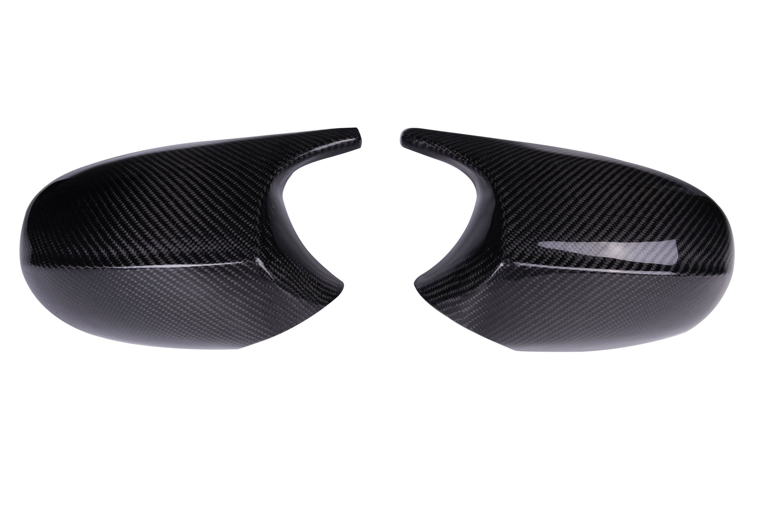 Two glossy carbon fiber mirror covers facing each other, exhibiting curved shapes and smooth surfaces, set against a plain white background.