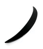 A sleek, black, curved object rests against a white background, resembling a crescent or boomerang shape, suggesting potential for aerodynamic purposes or decorative design.