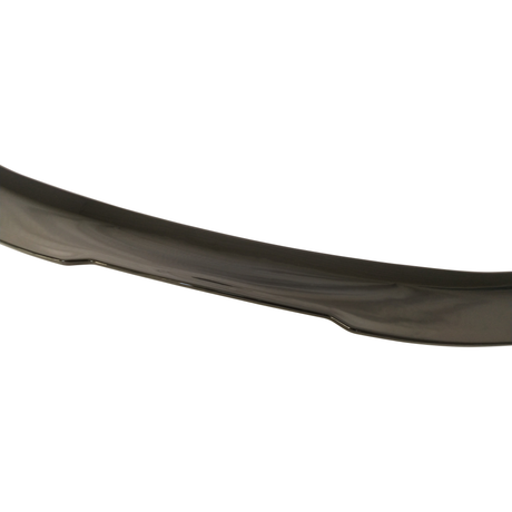 A curved, dark-colored car spoiler rests against a white background, highlighting its sleek and smooth surface texture.