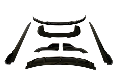 Black car body kit pieces arranged on a white background, including a bumper lip, side skirts, and diffuser parts, all presented symmetrically and evenly spaced.
