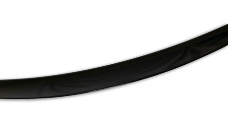 A glossy black curved object, possibly a part of a larger structure, bends gracefully against a plain white background.