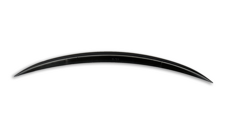 Curved black blade with a pointed tip, positioned horizontally on a plain white background. Its sleek, smooth surface is unadorned except for subtle markings along the edge.