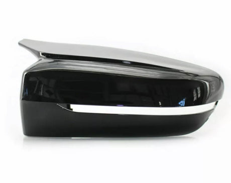 A sleek black side mirror with a chrome strip runs horizontally along its edge, set against a plain white background.