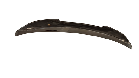 A shiny, curved metal car bumper with angular edges rests against a plain white background, suggesting it is a detached automotive part.