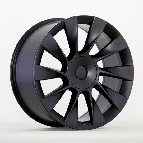 Black alloy wheel with a sleek, multi-spoke design is upright against a plain white background, highlighting its modern and aerodynamic appearance.