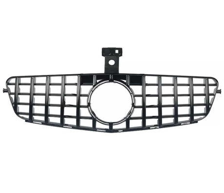 A black car grille with a rectangular grid pattern and central circular opening, positioned horizontally on a white background.