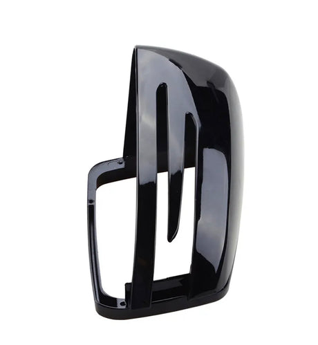 A glossy black car mirror cover with vertical slots, standing upright. The sleek, aerodynamic design suggests it is part of a modern vehicle's side mirror.