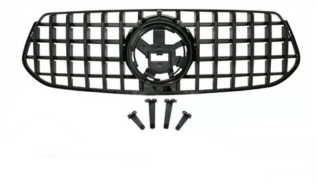 A black vehicle grille with a lattice design includes four mounting brackets below. The grille features a central circular emblem space, set against a plain background.