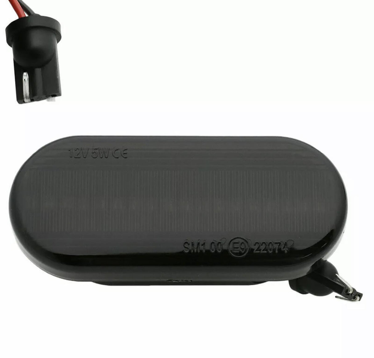 An oval black car side marker light labeled "12V5W CE SM1 06 (E9) 22974," with a socket and exposed wiring, set against a plain background.