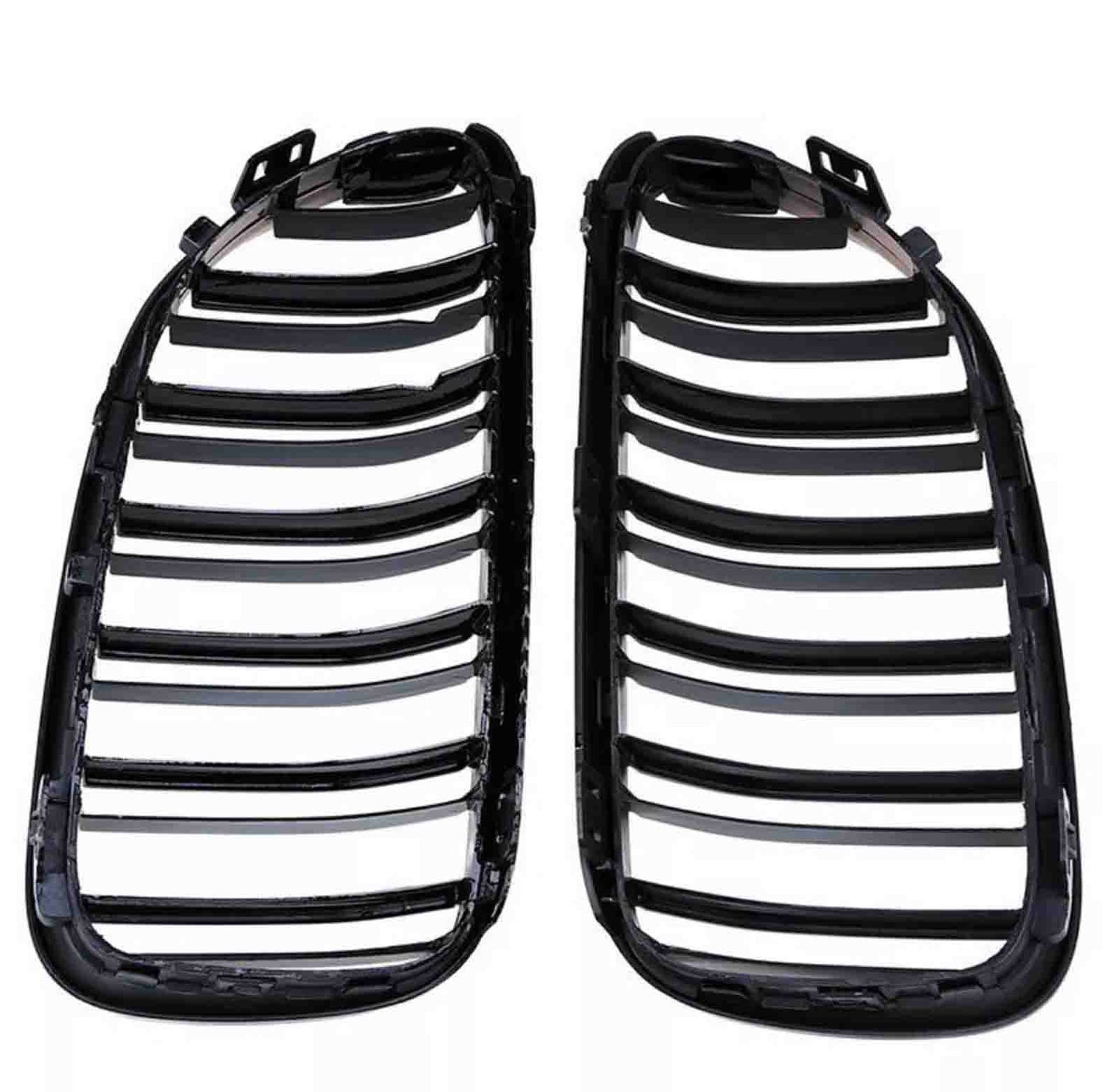 Two black plastic car grille inserts lie side by side, featuring multiple horizontal slats, against a plain white background.