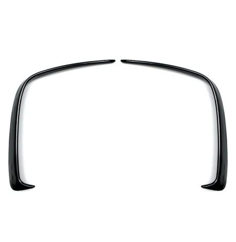 Two curved black plastic fender flares symmetrically facing each other, positioned on a plain white background.