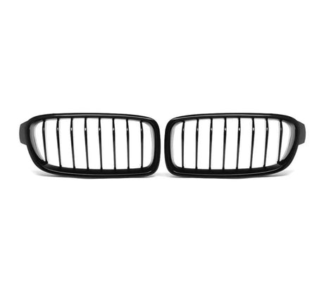 A pair of black, vertical-bar car grilles is placed on a plain white background, positioned side by side.