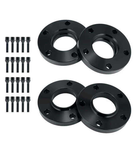 Four black circular wheel spacers with multiple bolt holes are arranged in pairs. Sixteen matching bolts are aligned vertically on the left side, indicating a set for automotive use.