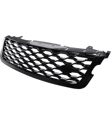 A black car grille with a hexagonal mesh pattern, shown against a white background, features mounting edges and a smooth, glossy finish.