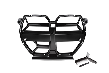 A glossy black car grille with two symmetrical sectioned openings, displayed on a plain white background, accompanied by a small, angular detached piece below.