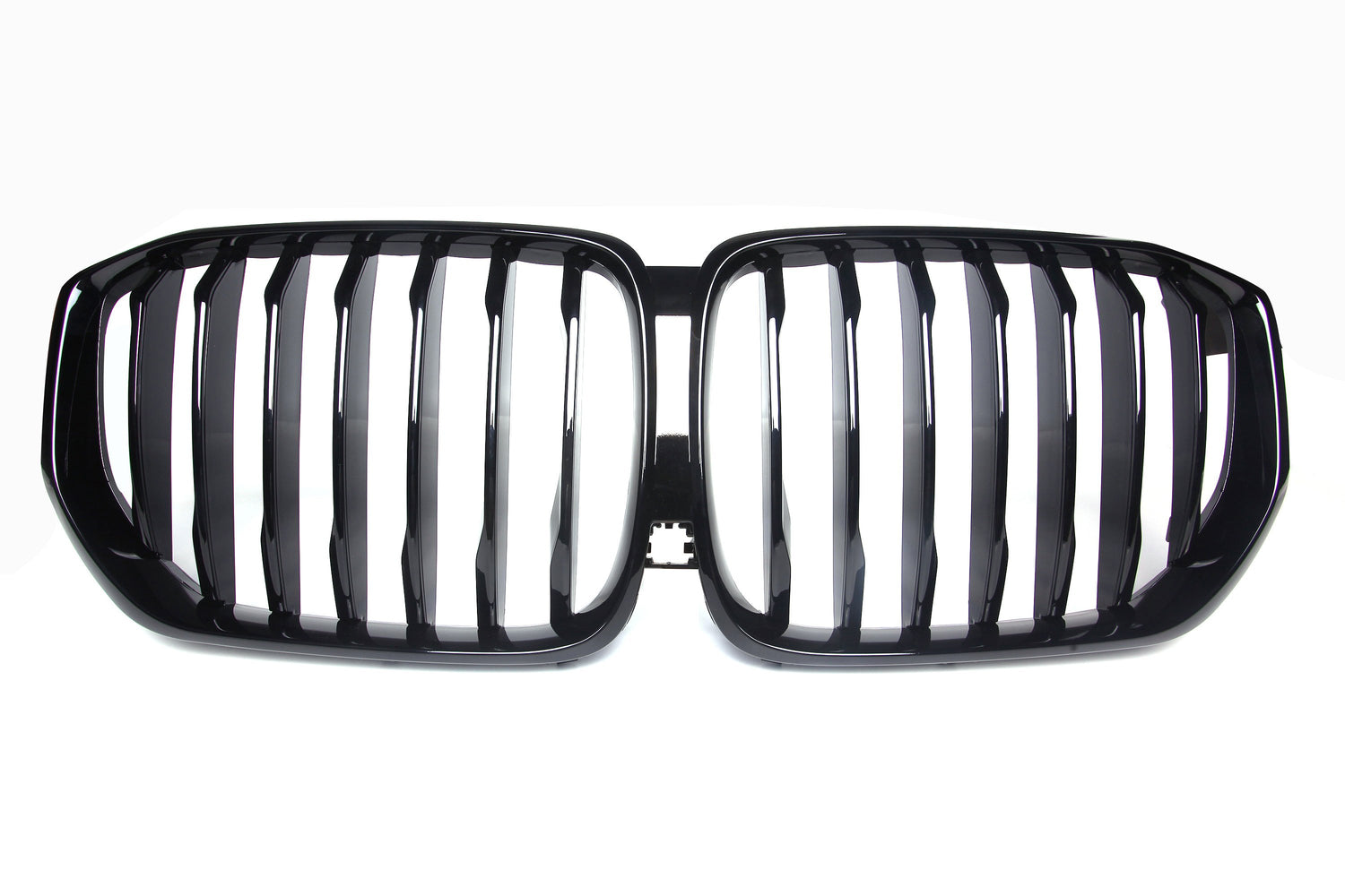 A shiny black car grille with vertical slats, forming two adjacent kidney-shaped sections, set against a plain white background.