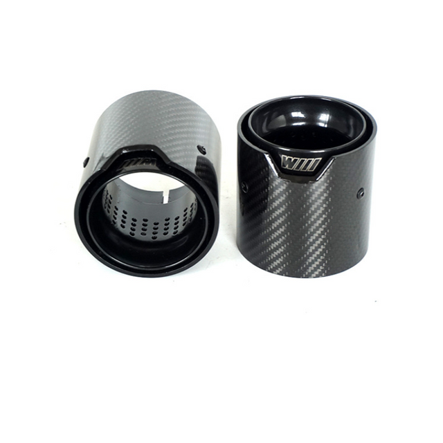 Two cylindrical carbon fiber exhaust tips are displayed against a white background. One is upright, showing a glossy interior and engraved "WILL," while the other lies on its side.