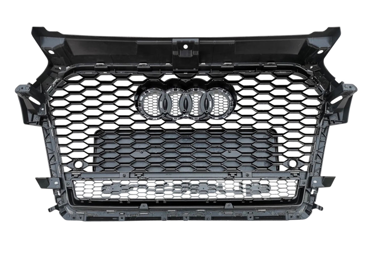 A black car grille featuring a hexagonal mesh pattern with four interlocking rings in the center, isolated on a white background.