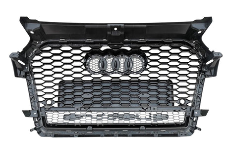 A black car grille featuring a hexagonal mesh pattern with four interlocking rings in the center, isolated on a white background.