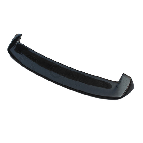 A curved carbon fiber car spoiler rests against a white background. It is glossy and designed to enhance aerodynamic performance.